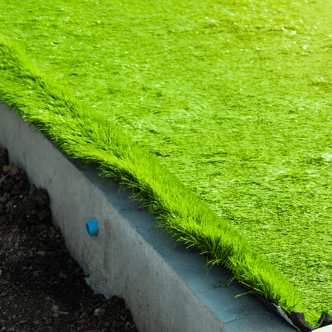 Synthetic Grass vs. Natural Grass: The Science Behind Premium Grass Blades Turf